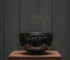 Yohen Tenmoku tea bowl showing iridescent halos in museum collection