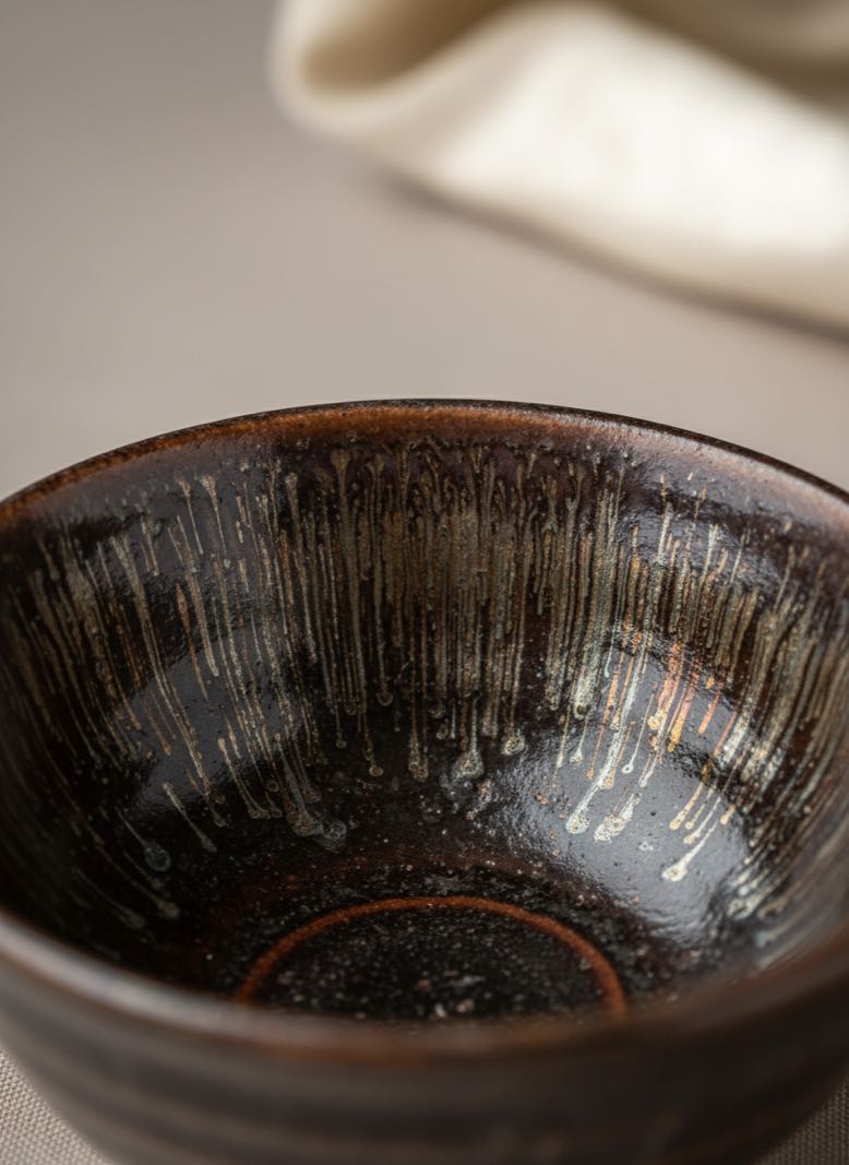 Close-up of Tenmoku hare's fur glaze pattern on tea bowl Close-up of Tenmoku hare's fur glaze pattern on tea bowl
